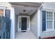 Charming front door entrance featuring elegant columns and a welcoming covered porch at 3049 Park West Blvd, Mount Pleasant, SC 29466