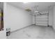 Spacious, clean garage interior, featuring concrete floors, white walls, and a new garage door system at 3049 Park West Blvd, Mount Pleasant, SC 29466