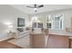 Inviting living room featuring neutral decor, abundant natural light, and ceiling fan at 3049 Park West Blvd, Mount Pleasant, SC 29466