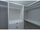 Walk-in closet with white shelving and drawers to maximize storage space at 318 Hollywood Dr, Charleston, SC 29407