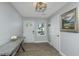 Charming entryway featuring hardwood floors, neutral walls, and a decorative table with floral arrangement at 318 Hollywood Dr, Charleston, SC 29407