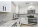 Modern kitchen featuring granite counters, subway tile backsplash, and stainless steel appliances at 318 Hollywood Dr, Charleston, SC 29407