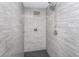 Sleek stand-up shower featuring modern fixtures, stylish gray tile, and a black shower floor at 318 Hollywood Dr, Charleston, SC 29407