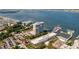 An aerial view showcases a waterfront condo building, a harbor with boats, and the Ravenel Bridge in the distance at 330 Concord St # 7 A, Charleston, SC 29401