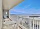 A bright balcony offers great views of the harbor with outdoor furniture, perfect for relaxation and enjoyment at 330 Concord St # 7 A, Charleston, SC 29401
