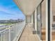 Outdoor balcony with chairs and a table overlooking the city skyline at 330 Concord St # 7 A, Charleston, SC 29401