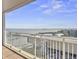 Balcony with white railings overlooking the cityscape, harbor, and beautiful blue sky at 330 Concord St # 7 A, Charleston, SC 29401