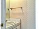 Small bathroom features decorative wallpaper and a vanity with a white sink at 330 Concord St # 7 A, Charleston, SC 29401