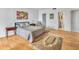 Comfortable bedroom featuring hardwood floors, comfortable queen-size bed and access to the bathroom at 330 Concord St # 7 A, Charleston, SC 29401