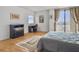 Bedroom featuring a bed, dresser, desk and chair, art and outside views at 330 Concord St # 7 A, Charleston, SC 29401