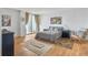 Cozy bedroom with hardwood floors, access to balcony, and comfortable queen-size bed at 330 Concord St # 7 A, Charleston, SC 29401