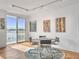 Dining area with glass table and chairs, and sliding glass doors at 330 Concord St # 7 A, Charleston, SC 29401