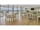 Bright dining area with ample seating, light wood floors, and expansive views at 330 Concord St # 7 A, Charleston, SC 29401