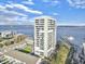 Aerial view featuring a waterfront condo building with balconies and views of the Ravenel Bridge in the distance at 330 Concord St # 7 A, Charleston, SC 29401