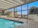 Indoor pool with bright windows overlooking palm trees offers a sunny swim year-round at 330 Concord St # 7 A, Charleston, SC 29401