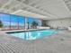 Indoor pool with bright windows and poolside seating offers a great view while you swim at 330 Concord St # 7 A, Charleston, SC 29401