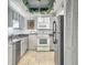 Kitchen equipped with stainless steel appliances, neutral cabinets and granite countertops at 330 Concord St # 7 A, Charleston, SC 29401