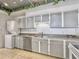 Kitchen with tile floors, appliances, washer and dryer and granite counter tops at 330 Concord St # 7 A, Charleston, SC 29401