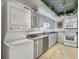 Kitchen with tiled floors and equipped with a washer and dryer combo unit at 330 Concord St # 7 A, Charleston, SC 29401