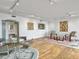 Bright living room with hardwood floors, track lighting, and seating area at 330 Concord St # 7 A, Charleston, SC 29401