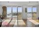 Sun-filled living room with sliding glass doors that provide access to the balcony at 330 Concord St # 7 A, Charleston, SC 29401