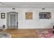 Living room with hardwood floors, stylish seating, and connecting view to the kitchen at 330 Concord St # 7 A, Charleston, SC 29401