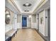 Well-lit lobby with tiled floor, a mirror, and a bench provides a welcoming entrance to the building at 330 Concord St # 7 A, Charleston, SC 29401