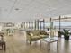 Bright lounge with large windows and comfortable seating for residents to relax and enjoy the water view at 330 Concord St # 7 A, Charleston, SC 29401