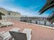 Brick patio with lounge chairs, palm trees, and harbor views at 330 Concord St # 7 A, Charleston, SC 29401