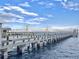 Stunning view of pier with bridge under a blue sky with fluffy clouds at 330 Concord St # 7 A, Charleston, SC 29401