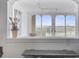View of scenery visible through arched windows with nearby houseplants at 330 Concord St # 7 A, Charleston, SC 29401