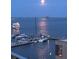 Beautiful view of water with boats at night and a full moon at 330 Concord St # 7 A, Charleston, SC 29401
