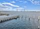 Scenic water view featuring a pier and bridge under a beautiful sky at 330 Concord St # 7 A, Charleston, SC 29401