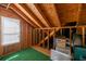 Unfinished attic featuring exposed rafters and a window, providing potential storage or renovation space at 350 Arlington Dr, Charleston, SC 29414