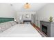 Comfortable bedroom showcasing hardwood floors, stylish rug, and a decorative fireplace at 350 Arlington Dr, Charleston, SC 29414