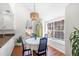 Cozy breakfast nook with ample natural light, a round table, and stylish blue chairs with floral cushions at 350 Arlington Dr, Charleston, SC 29414