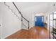 Inviting entryway showcasing hardwood floors and a bright blue front door at 350 Arlington Dr, Charleston, SC 29414