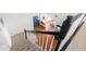 Bright foyer showcasing hardwood floors, a blue front door and staircase with carpeted steps at 350 Arlington Dr, Charleston, SC 29414