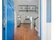 Inviting open-concept living space with hardwood floors, staircase, and cozy seating around a blue fireplace at 350 Arlington Dr, Charleston, SC 29414