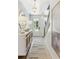Stylish entryway with patterned wallpaper, modern lighting, and decorative accents at 351 Claret Cup Way, Charleston, SC 29414