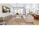 Bright and open living room with sectional sofa, large windows, and modern decor at 351 Claret Cup Way, Charleston, SC 29414