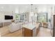 Inviting open-concept space with kitchen island, living room, and dining area at 351 Claret Cup Way, Charleston, SC 29414
