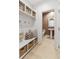 Charming mudroom with storage bench, baskets, and convenient access to powder room at 351 Claret Cup Way, Charleston, SC 29414