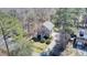 Aerial view of a charming home nestled among trees, showcasing its well-maintained lawn and surroundings at 3651 Barton St, Johns Island, SC 29455