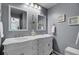 Elegant bathroom with a double sink vanity, mirrors, and stylish fixtures at 3651 Barton St, Johns Island, SC 29455