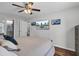 Bright bedroom with mounted TVs, wood floors, and access to the bathroom at 3651 Barton St, Johns Island, SC 29455