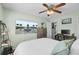 Comfortable bedroom featuring desk, ceiling fan, and mounted television at 3651 Barton St, Johns Island, SC 29455