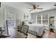 Inviting bedroom/office space featuring desk, windows, and a ceiling fan at 3651 Barton St, Johns Island, SC 29455