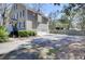 Home exterior featuring an ample driveway, green lawn, and well-maintained landscaping at 3651 Barton St, Johns Island, SC 29455
