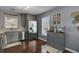 Gray kitchen with stainless steel appliances and breakfast bar at 3651 Barton St, Johns Island, SC 29455